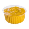 Mustard in small plastick bowl isolated