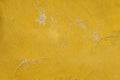 mustard yellow cement wall texture background has scratches and scuff marks Royalty Free Stock Photo