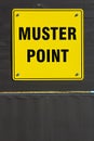 Muster assembly point sign on a wooden wall