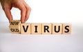 Mutated covid virus symbol. Male hand turns a cube and changes words `old virus` to `new virus`. Beautiful white background.