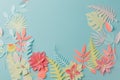 Muted color colorful flower composition - handmade papercraft flowers and leaves on pastel blue background, sprin, summer, easter