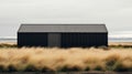 Muted Colors And Calming Symmetry: A Black Barn In A Field