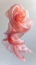 a muted pink silk scarf folded and twisted into an abstract shape that creates a sense of fluidity and movement