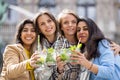 Muti ethnic group of female friends having fun drinking cocktails outdoor in the city in bar restaurant Royalty Free Stock Photo