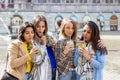 Muti ethnic group of female friends having fun drinking cocktails outdoor in the city in bar restaurant Royalty Free Stock Photo