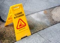 December 25, 2019 : Yellow signage of cleaning in progress on wet floor tile for indoor