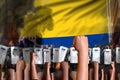 mutiny fighting concept - protest in Colombia on flag background, police special forces stand against the angry crowd - military