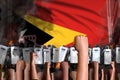 mutiny stopping concept - protest in Timor-Leste on flag background, police special forces stand against the protesting crowd -