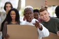 Mutiracial group of demonstrators striking on the street Royalty Free Stock Photo