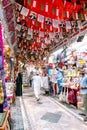 MUTRAH, MUSCAT, OMAN - NOVEMBER 14, 2022: People shopping in Muttrah souq in Muscat, Oman.