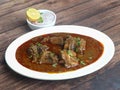 Mutton curry or Lamb curry, spicy and delicious dish served over a rustic wooden background, selective focus Royalty Free Stock Photo