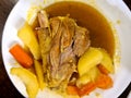 Mutton curry, potatoes, carrot slice in plate. Lamb meat delicious cooked food.