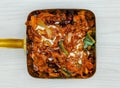 mutton karahi in a dish top view on grey background