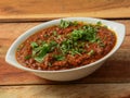 Mutton kheema curry or lamb kheema curry, spicy and delicious dish served over a rustic wooden background, selective focus Royalty Free Stock Photo