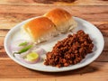 Mutton Kheema pav or keema Pav is a spicy curry dish made up of minced mutton cooked with onion, tomatoes, served with buns or pav