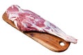 Mutton meat. Raw whole lamb leg thigh on butcher board. Isolated, white background.