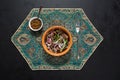 Mutton pieces stewed in a pot in a black table.