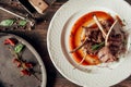 Mutton ribs dish top view composotion with red sauce at dark wooden background