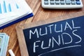 Mutual funds handwritten on a desk Royalty Free Stock Photo