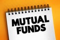Mutual Funds - professionally managed investment fund that pools money from many investors to purchase securities, text concept on Royalty Free Stock Photo