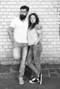 Mutual romance. Sensual woman and bearded man enjoying romance in relationship. Romantic couple in love hugging on brick Royalty Free Stock Photo