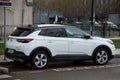 Profile view of white opel mokka suv car parked in the street