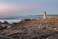 Muxia Lighthouse at sunset Royalty Free Stock Photo