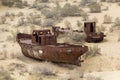 MUYNAQ, UZBEKISTAN - APRIL 22, 2018: Rusty ships at the ship cemetery in former Aral sea port town Moynaq Mo ynoq or Royalty Free Stock Photo