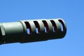 Muzzle barrel of military tank artillery gun on a blue sky background. copy space, selective focus, narrow depth of field. Royalty Free Stock Photo