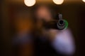 Muzzle of single barrelled shotgun on blurred background of aiming man Royalty Free Stock Photo