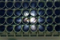 Muzzles barrels of military tank artillery gun on a blue sky background with child face. copy space, selective focus, narrow depth Royalty Free Stock Photo