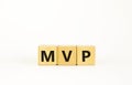 MVP, minimum viable product symbol. Wooden cubes with the word MVP, minimum viable product. Beautiful white background. Business Royalty Free Stock Photo