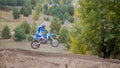 MX moto cross racing - Girl Bike Rider rides on a dirt motorcycle - extreme jump