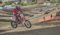 MX moto cross racing - Girl Bike Rider riding on dirt track - extreme jump. Extreme Motocross .