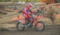 MX moto cross racing - Girl Bike Rider riding on dirt track - extreme jump. Extreme Motocross .