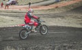 MX moto cross racing - Girl Bike     Rider riding on dirt track - extreme jump. Extreme Motocross . Royalty Free Stock Photo