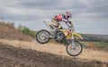 MX moto cross racing - Girl Bike     Rider riding on dirt track - extreme jump. Extreme Motocross . Royalty Free Stock Photo