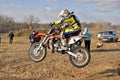 MX rider on a motorbike jumps jumping hill Royalty Free Stock Photo