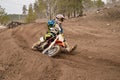 MX rider veering point-blank of sand with
