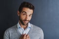 My ambition is to succeed. Portrait of a handsome young businessman posing against a dark background. Royalty Free Stock Photo