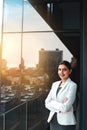 My ambitions are as big as the city. Portrait of a young businesswoman standing on the office balcony.