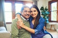 My baby girl is all grown up now. Portrait of a cheerful senior man posing with his daughter while relaxing on a couch Royalty Free Stock Photo