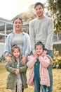 This is my beautiful family. Shot of a young couple and their two daughters standing outside their home. Royalty Free Stock Photo