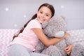 My best friend. Favorite toy. Pure love concept. Girl child hug teddy bear in her bedroom. Pleasant time in cozy bedroom