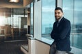 My business is growing, expanding and thriving. Portrait of a confident young businessman working in a modern office. Royalty Free Stock Photo