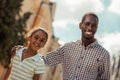 Positive delighted international family looking at camera