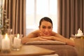 In my comfort zone. A beautiful young woman relaxing on a massage table before her massage.