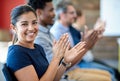 My company rewards outstanding performance. Portrait of a smiling businesswoman applauding a presentation along with