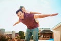 My daddy and my best friend. Portrait of a happy little girl and her father playing together in their backyard at home. Royalty Free Stock Photo