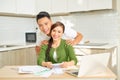 My dear. Loving smiling husband massaging shoulders of his beautiful wife in the kitchen